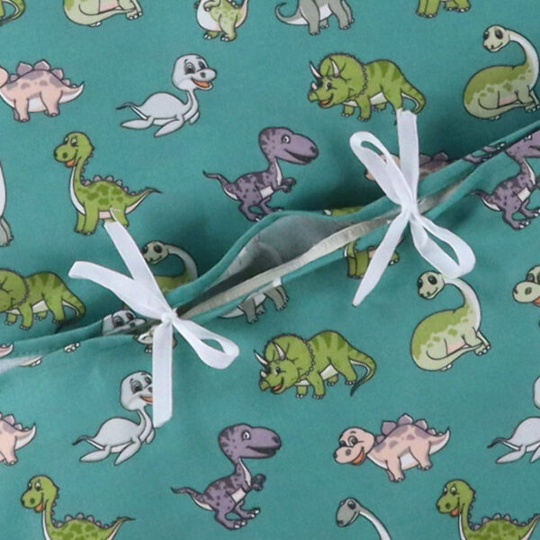 Nørgaard Madsens Sengetøj - Baby - Grøn m. Glade Dinoer